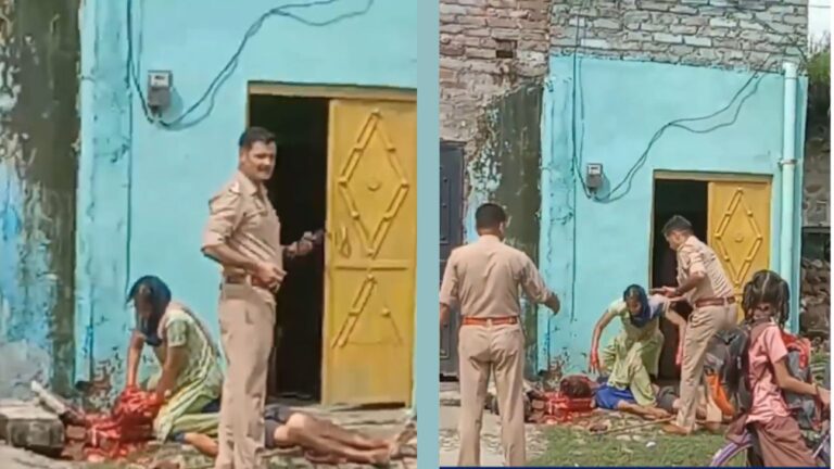 A woman in Shahjahanpur, Uttar Pradesh, sits on her deceased husband's body after brutally killing him with a brick following a dispute over food. Police officers stand nearby as the woman cries and speaks incoherently.
